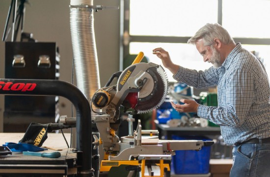 Student working a woodcutting buzzsaw